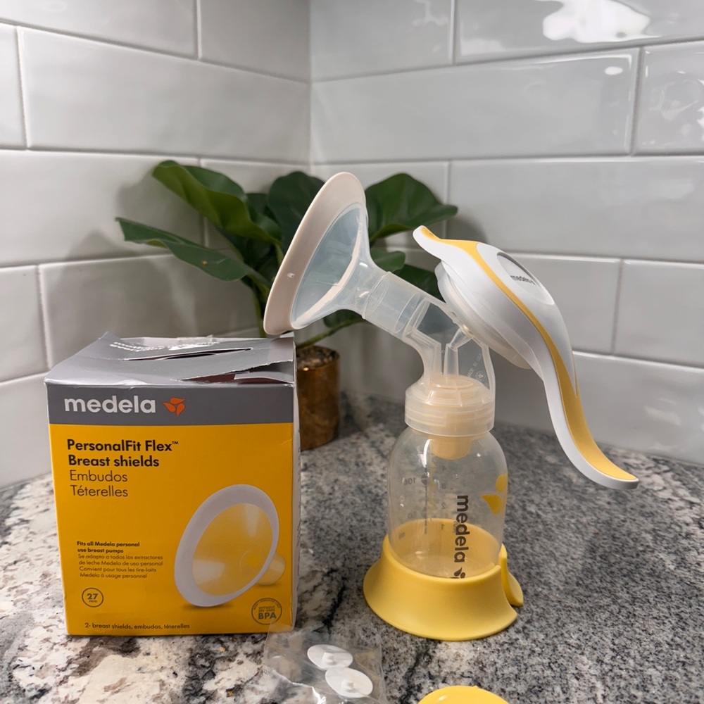 Medela Yellow and White Breast Pump with PersonalFit Flex Shields